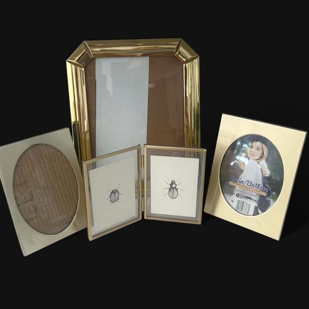 Set of 4 Gold mis matched Gold tone frames that hold 5 pictures